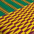 Patterned fabric with green, yellow, and maroon colors