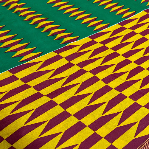 Patterned fabric with green, yellow, and maroon colors