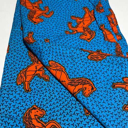 Blue fabric with orange horse pattern