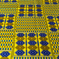 Patterned fabric with blue and yellow geometric design
