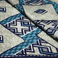 Close-up of fabric with blue and gray geometric pattern