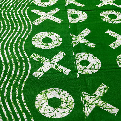 Green fabric with white 'XOXO' pattern