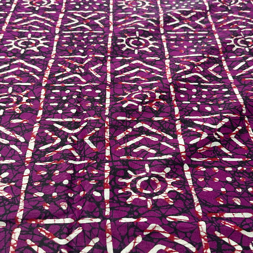 Purple fabric with white geometric patterns