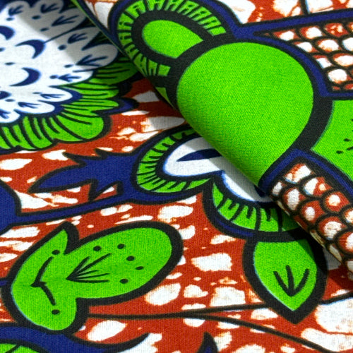 Close-up of colorful fabric with green leaves and blue patterns