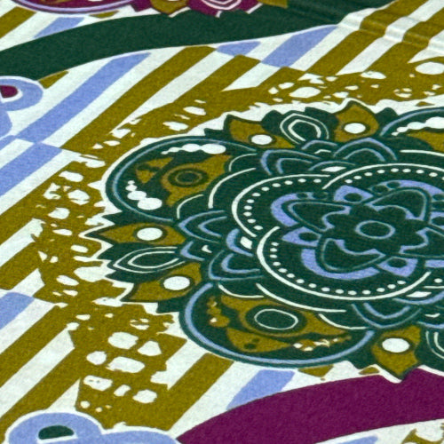 Close-up of a colorful fabric with intricate patterns and designs.