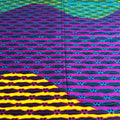 Colorful patterned fabric with wavy lines and geometric shapes