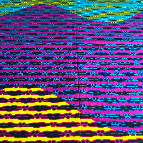 Colorful patterned fabric with wavy lines and geometric shapes