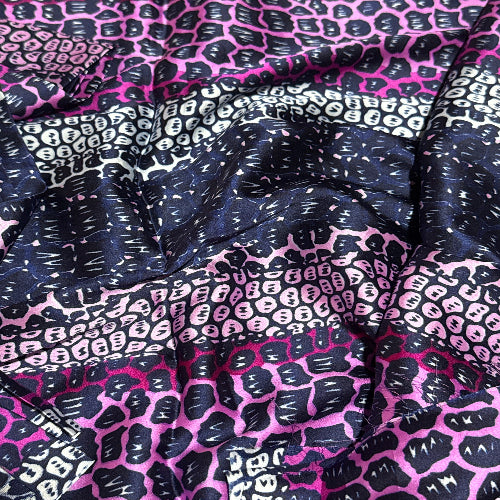 Close-up of fabric with pink and black pattern