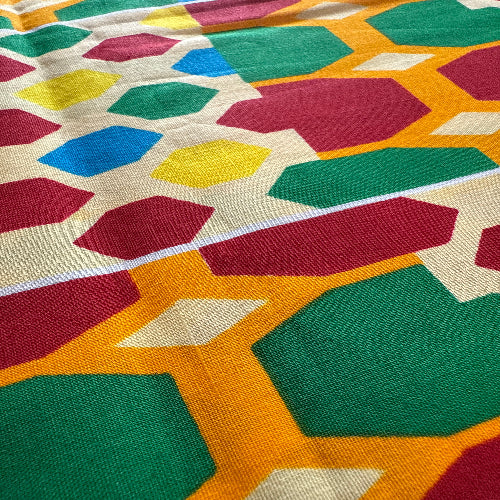 Close-up of a colorful geometric patterned fabric.