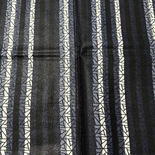 Black and white striped pattern with geometric shapes on a textured background