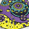 Colorful geometric pattern with purple, yellow, and black on a white background