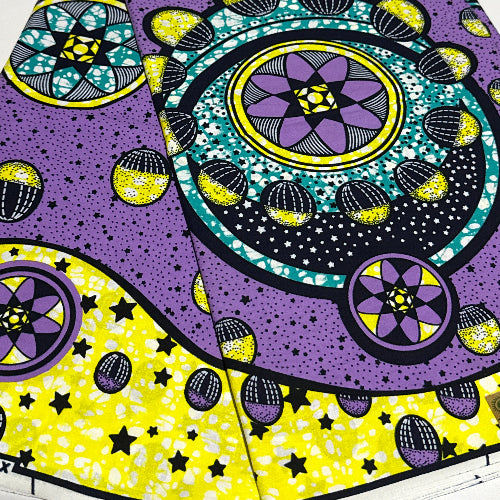 Colorful geometric pattern with purple, yellow, and black on a white background