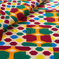 Colorful geometric patterned fabric with hexagonal shapes.