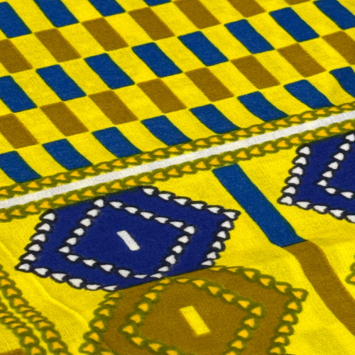 Close-up of a patterned fabric with blue, yellow, and brown colors.