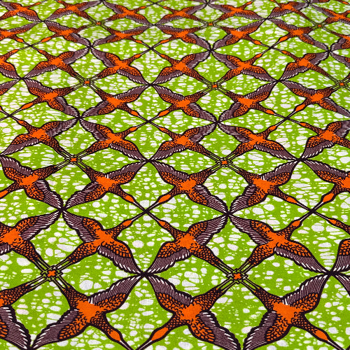African fabric pattern with birds on a green background