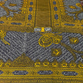 Decorative fabric with intricate gold and black patterns