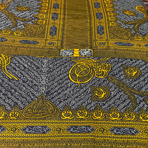 Decorative fabric with intricate gold and black patterns