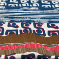 Close-up of fabric with blue, white, and red geometric pattern