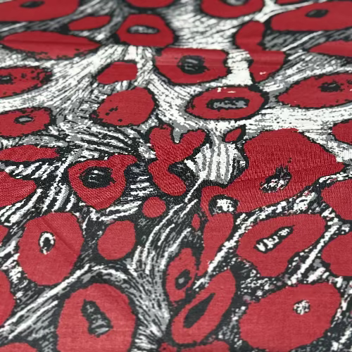 Close-up of fabric with red and black floral pattern