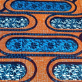 Close-up of fabric with blue and orange pattern