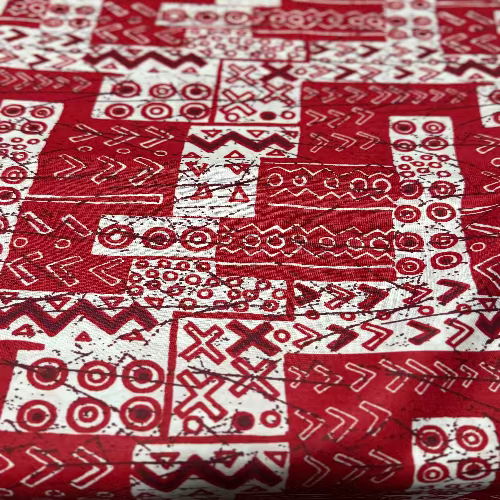 Red and white patterned fabric with geometric designs