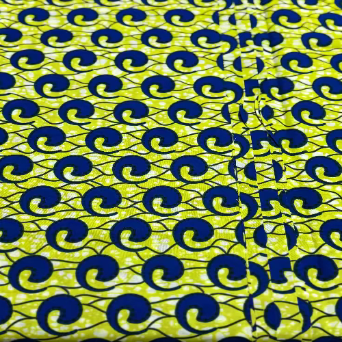 Fabric with blue and black wave pattern on a yellow background