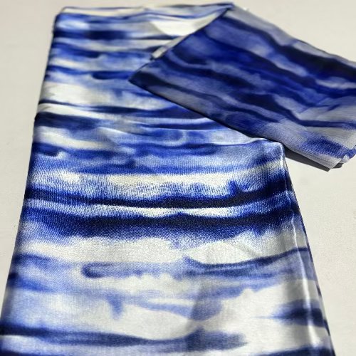 Blue and white striped fabric on a light gray background