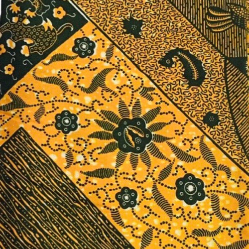 Traditional batik pattern with black designs on a yellow background