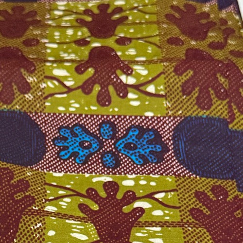 Patterned fabric with brown hand-like shapes and blue abstract designs on a multicolored background