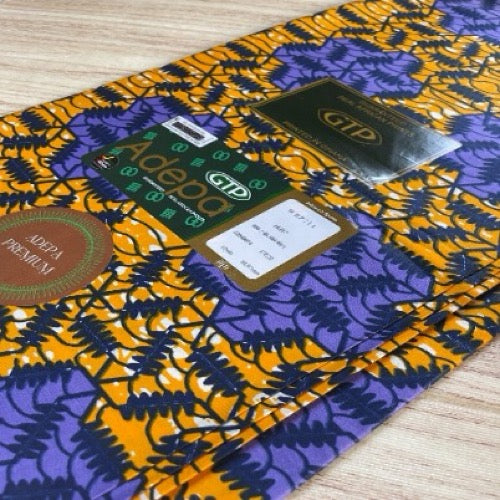 Adepa branded products on a colorful fabric background