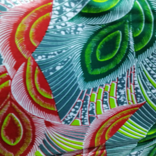 Close-up of vibrant fabric with red, green, and blue patterns