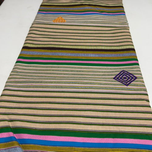 Striped fabric with embroidered patterns on a white background