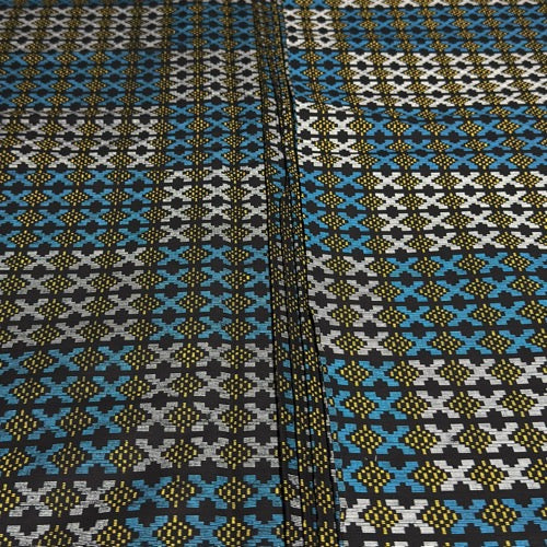 Patterned fabric with blue, black, and yellow design