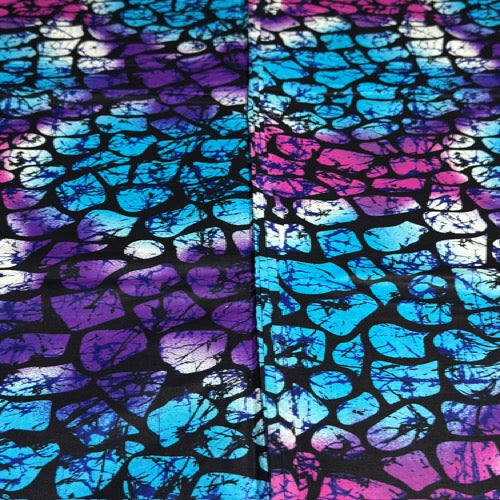 Tie-dye pattern with blue and purple hues on a black background