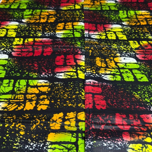 Colorful abstract patterned fabric with a grid-like design.