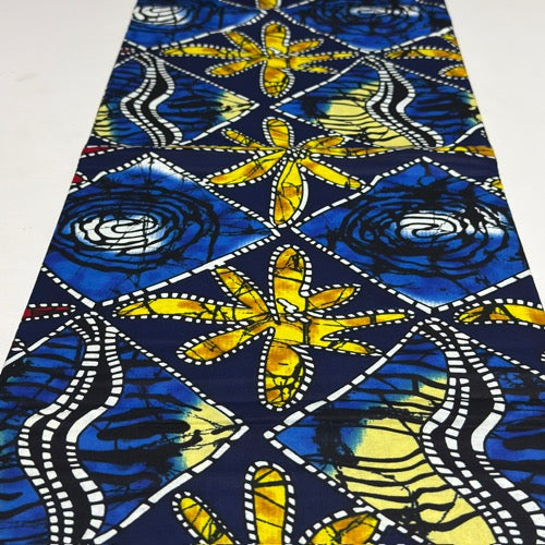 African print fabric with blue and yellow floral patterns on a white background