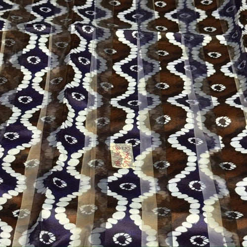 Patterned fabric with blue, brown, and white colors