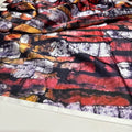 Close-up of colorful fabric with an abstract pattern on a white background