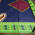 Colorful fabric with geometric patterns and a peacock design on a blue background