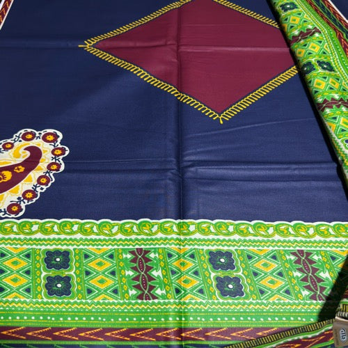 Colorful fabric with geometric patterns and a peacock design on a blue background