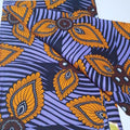 African print fabric with orange and purple pattern